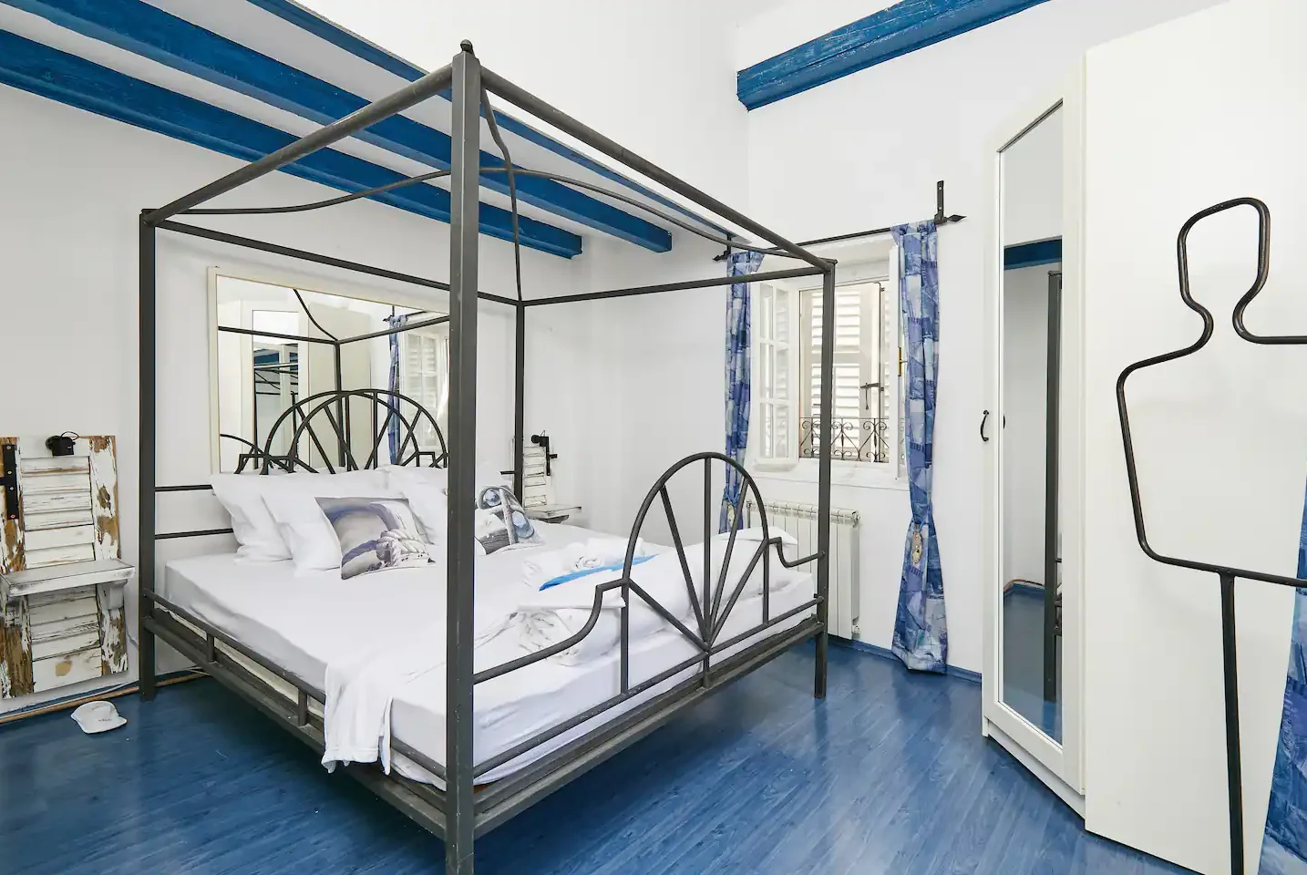 Queen bedroom with blue wooden beams at Aspida in Kotor